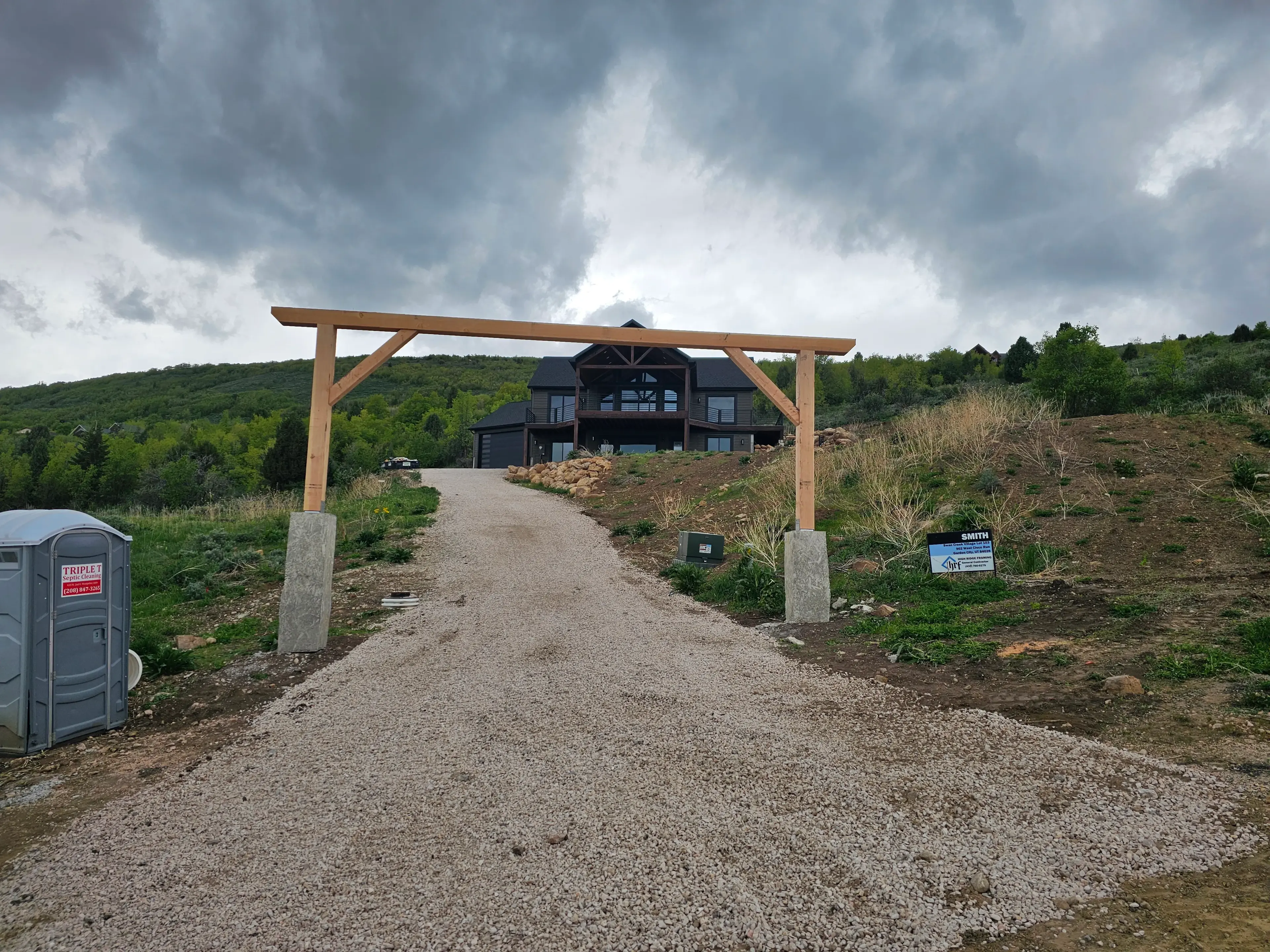 Engineered structural retaining walls blending into Logan landscaping