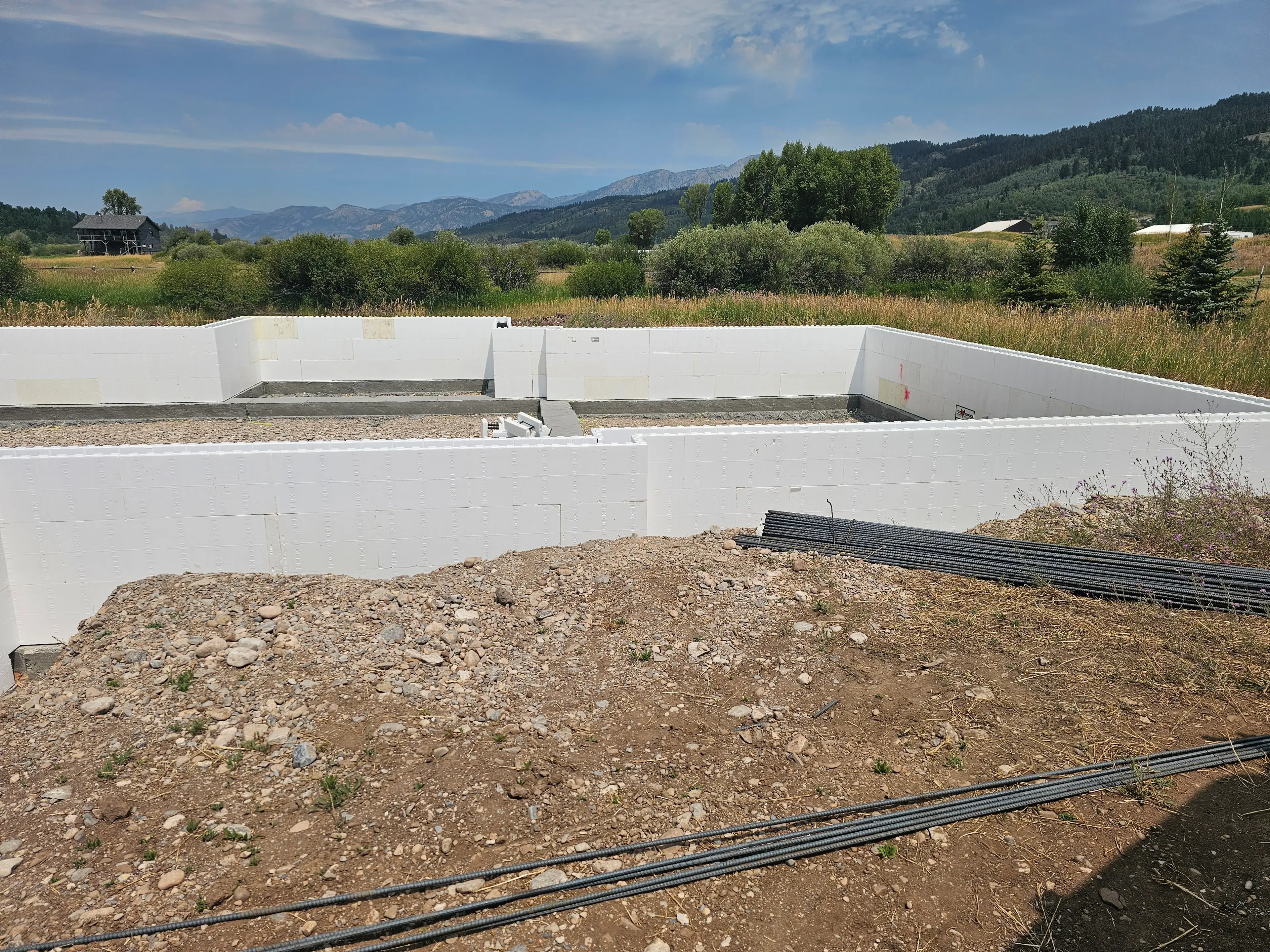 Cured structural retaining walls on steep lot