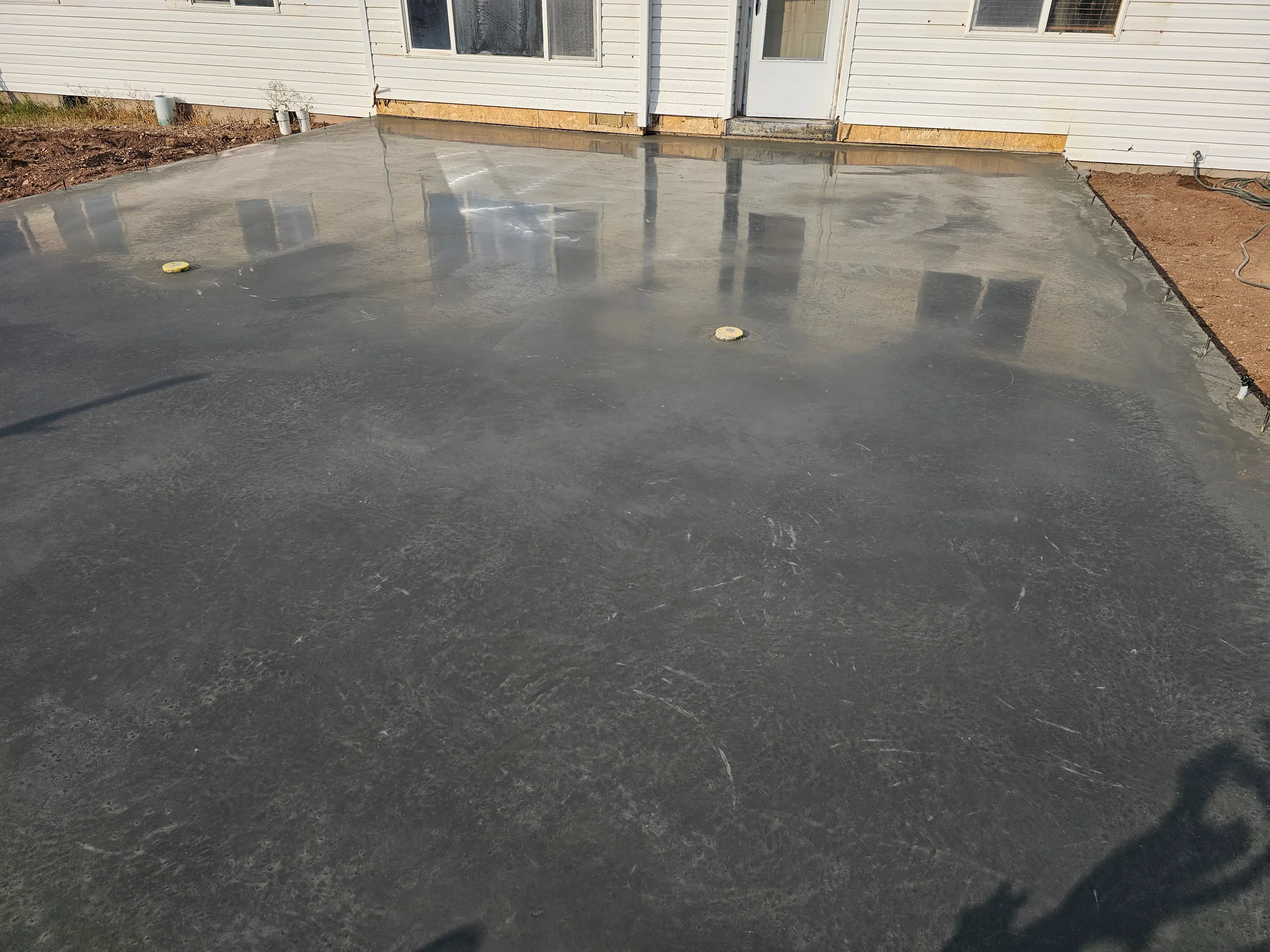 Deep utility and foundation trenches dug by heavy machinery