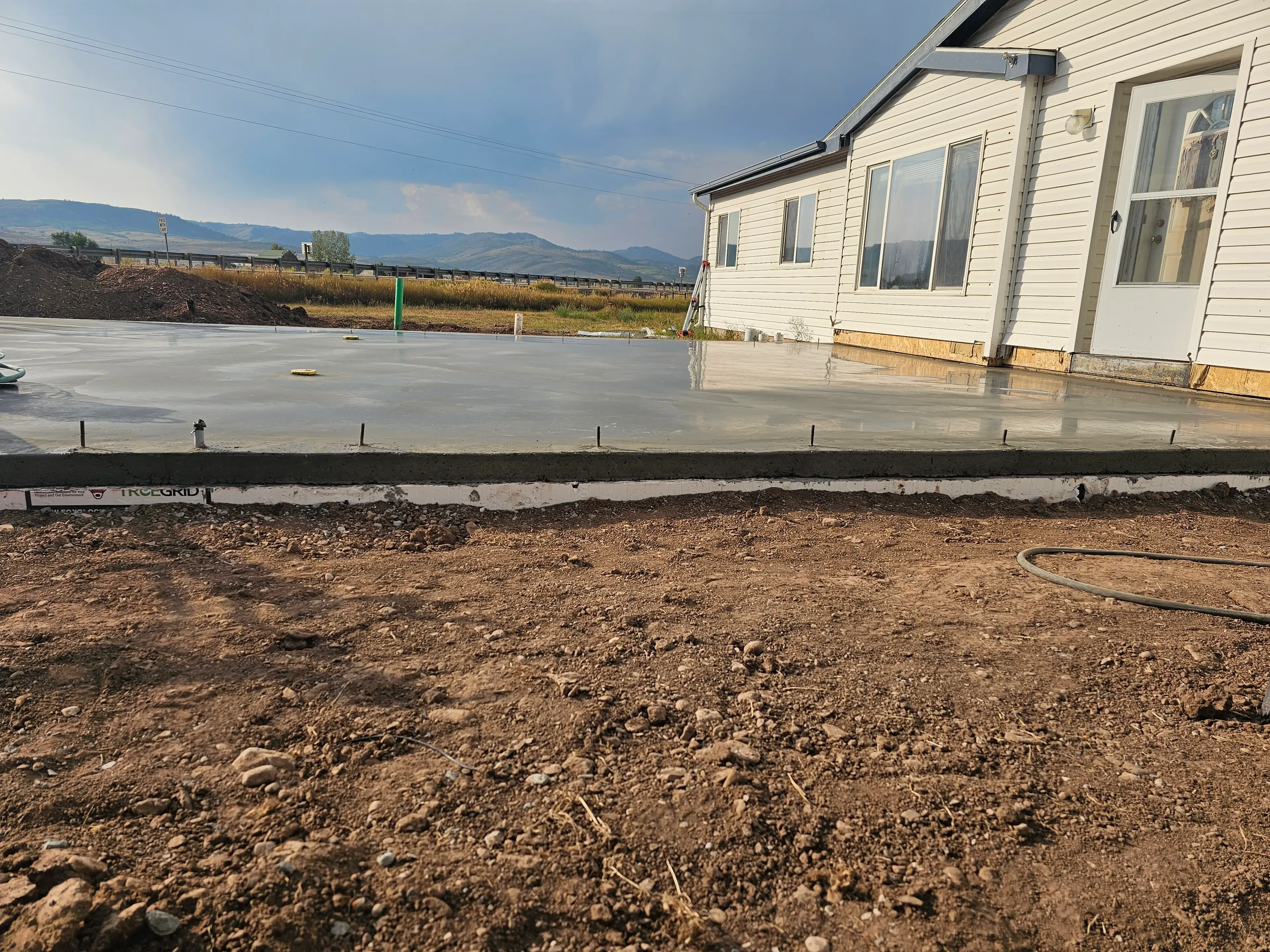 Heavy earthmoving equipment preparing a site