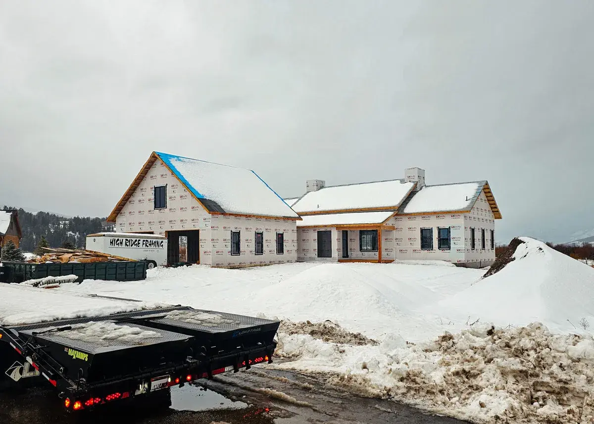 HRF Customs heavy machinery executing mass excavation on a steep mountain lot